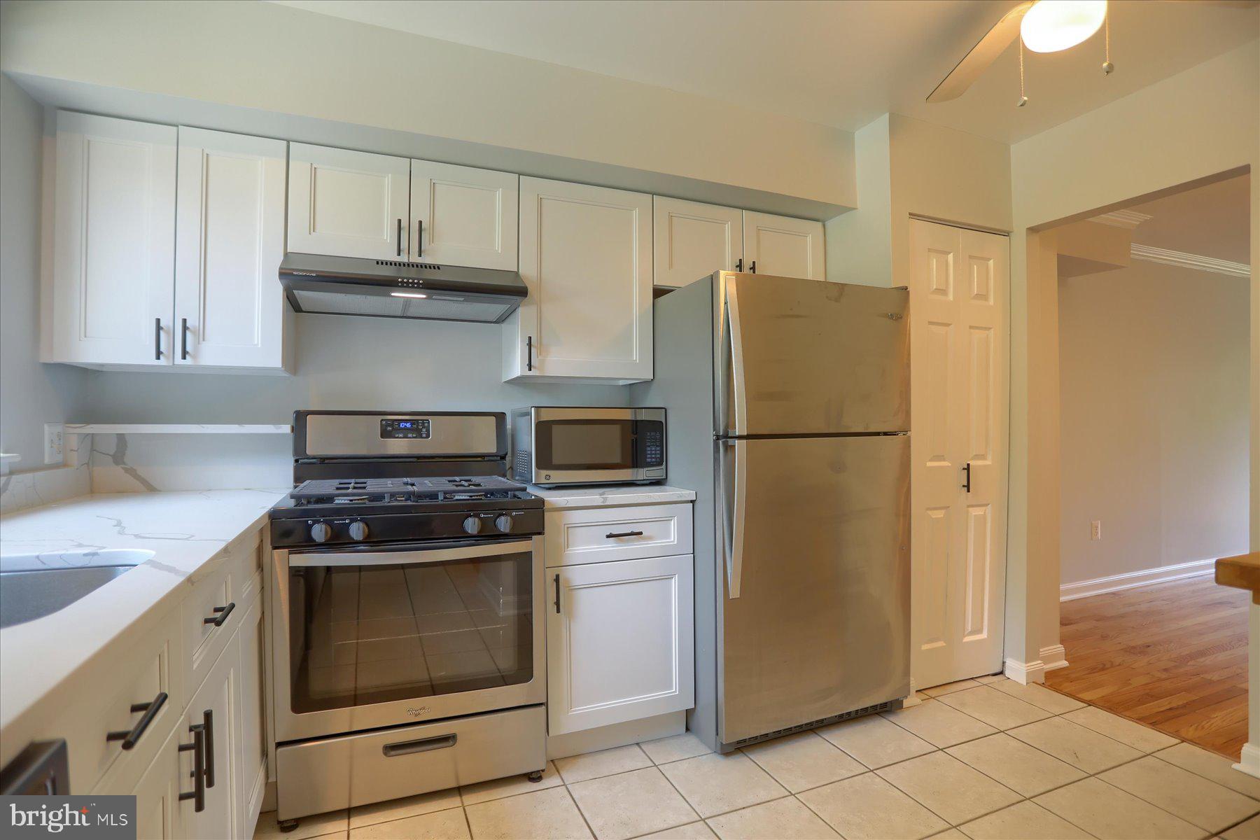20 Stone Ridge Court, Unit 22 Baltimore, MD 21239 - Photo 3 of 37 Kitchen w/ SS Appliances