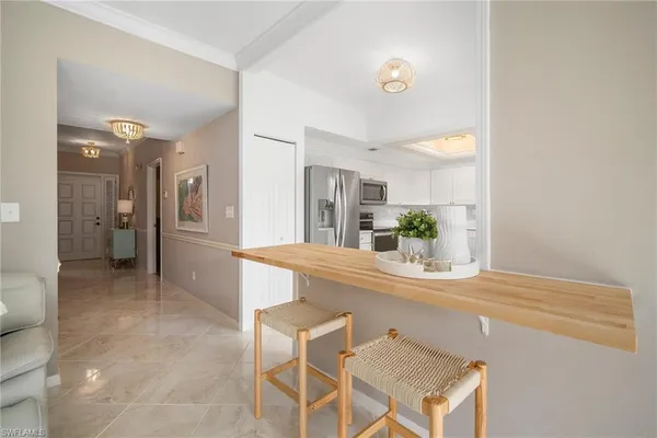 a view of a kitchen from a dining room