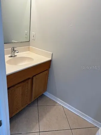 a room with a sink and a mirror