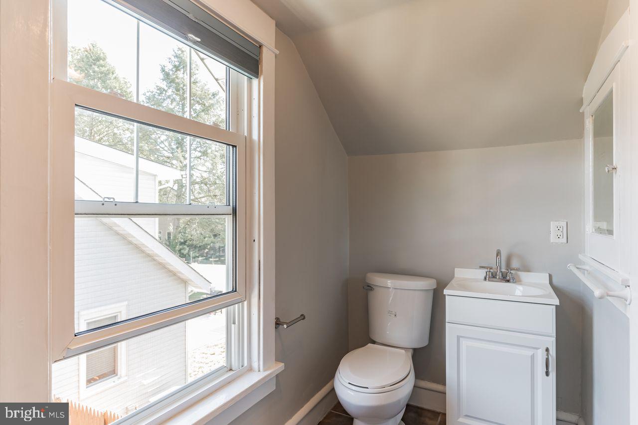 204 Princeton Road Audubon, NJ 08106 - Photo 15 of 22 a bathroom with a toilet sink and large window