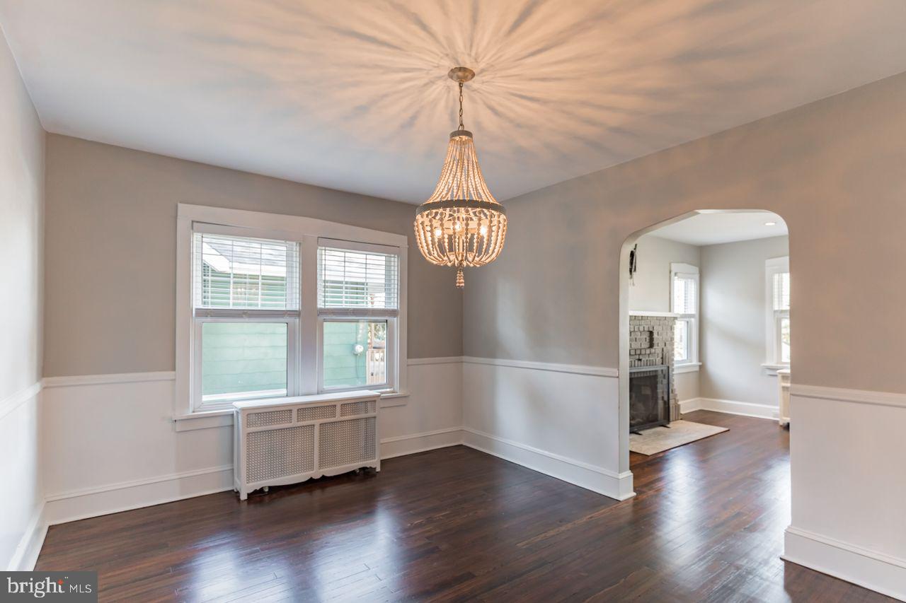 204 Princeton Road Audubon, NJ 08106 - Photo 4 of 22 a view of an empty room with wooden floor and a window