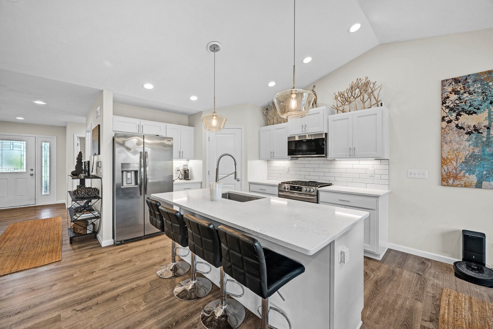 277 Cassidy Road Normal, IL 61761 - Photo 7 of 42 a kitchen with stainless steel appliances a stove a sink a refrigerator and a fireplace