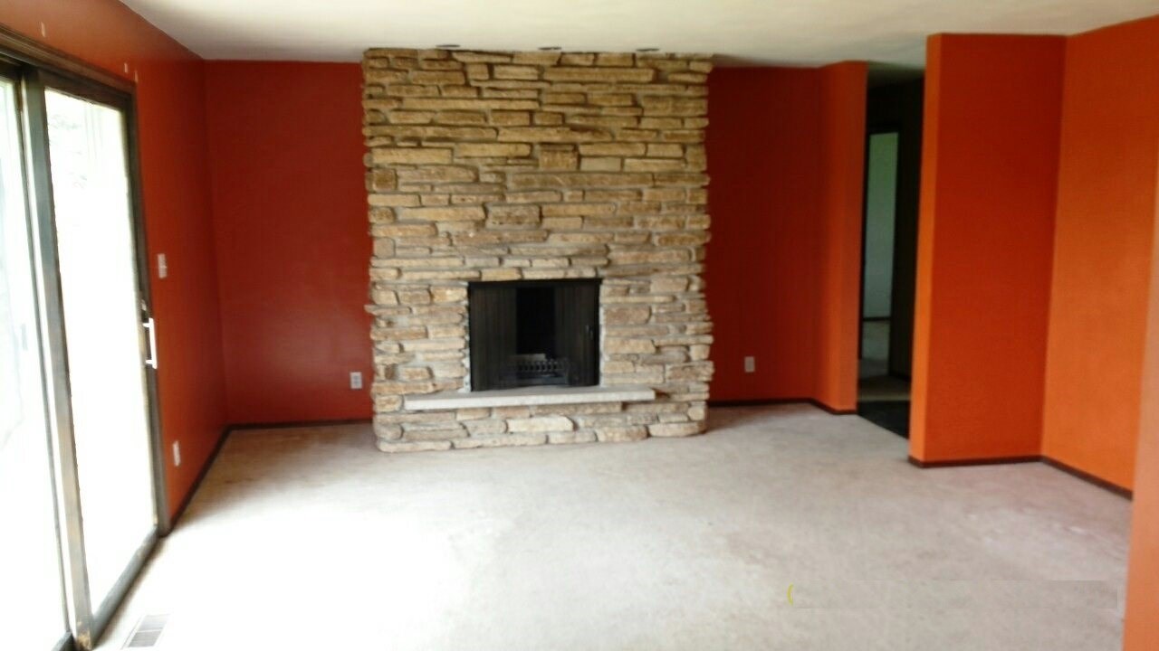 6952 Cemetery Road Rockford, IL 61101 - Photo 8 of 20 a view of an empty room with a fireplace
