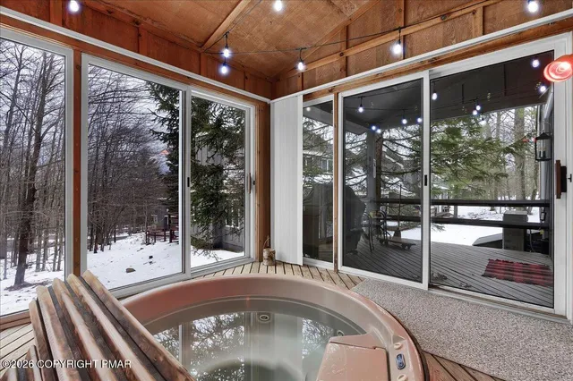 a view of a living room and a large window