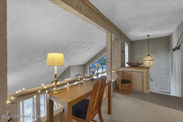 a bedroom with a bunk bed and a window