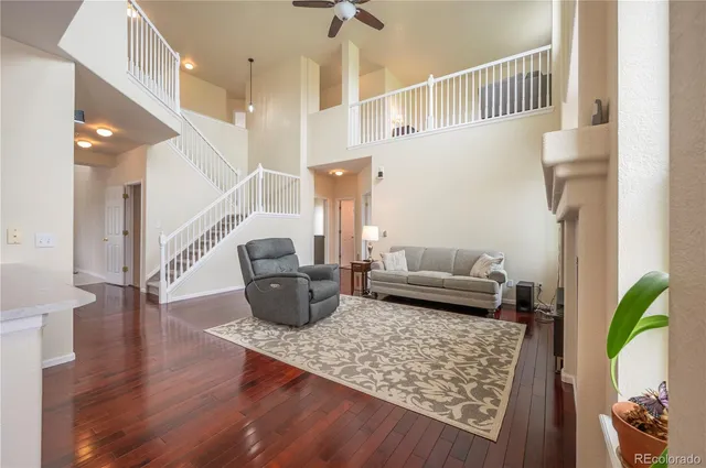 a living room with furniture and a rug