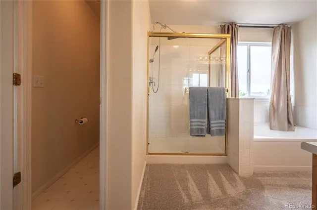 a bathroom with a glass shower door
