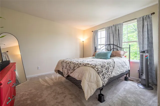 a view of a porch with furniture and a garage