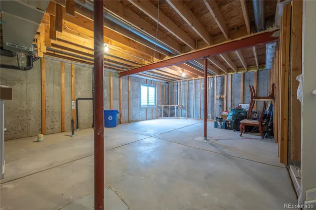 a front view of a house with a garden and trees