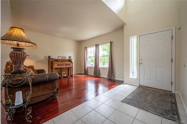 a view of a livingroom with furniture and a window