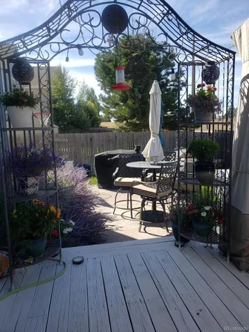 a bunch of flowers sitting in front of a house