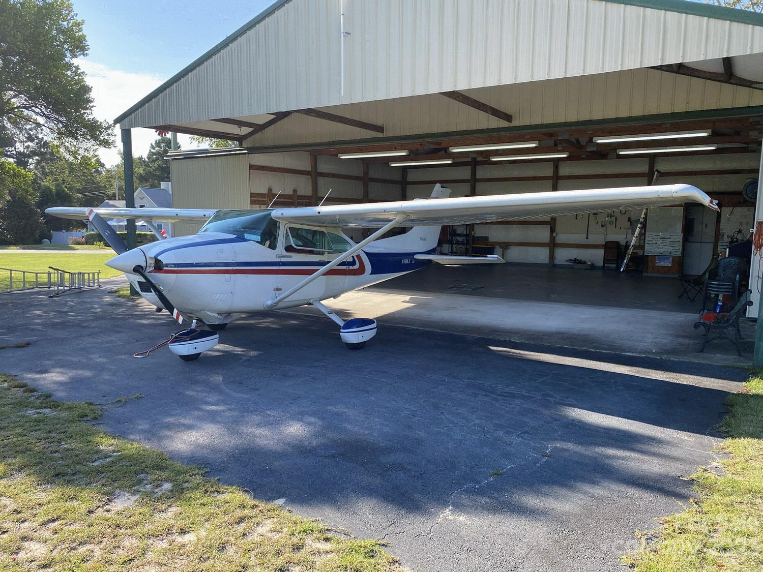 304 Downwind Leg Gilbert, SC 29054 - Photo 2 of 3 a roof deck with table and chairs under an umbrella