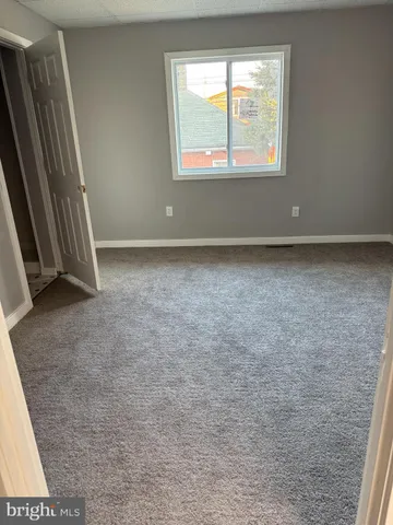 a bathroom with a sink a mirror and shower