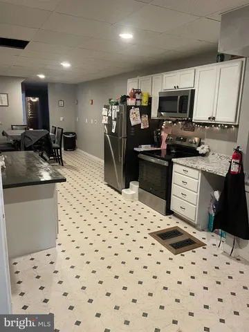 a kitchen with a sink a stove and refrigerator