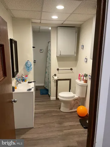 a bathroom with a sink mirror vanity and toilet