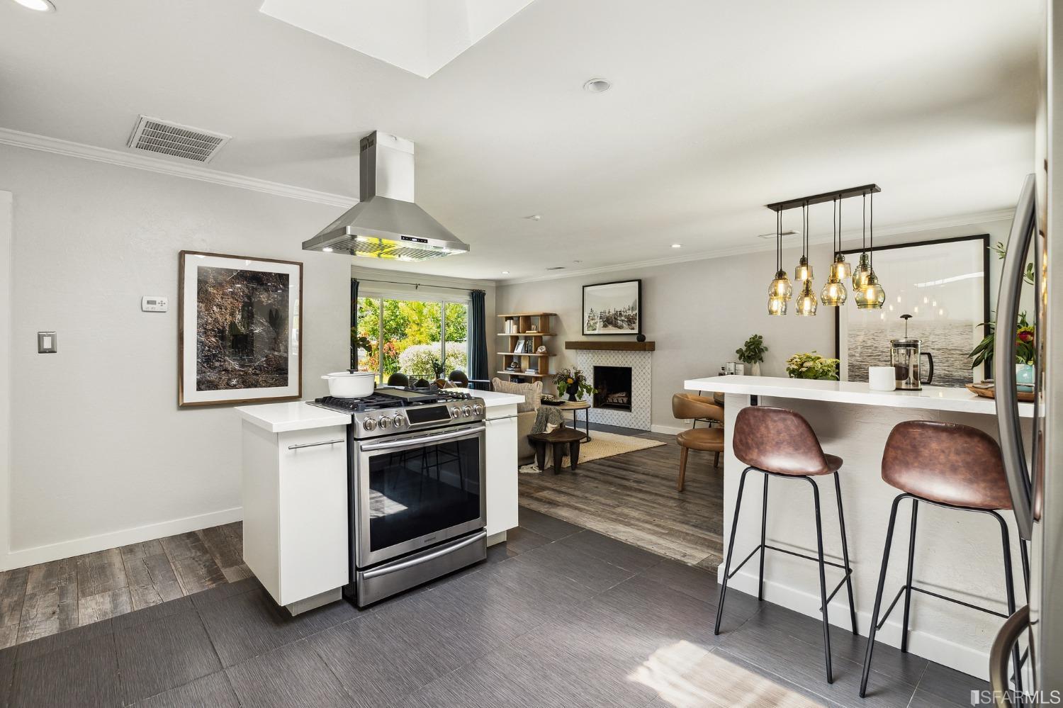 1615 Linda Mar Boulevard Pacifica, CA 94044 - Photo 18 of 41 a kitchen with stainless steel appliances granite countertop a stove and a chair