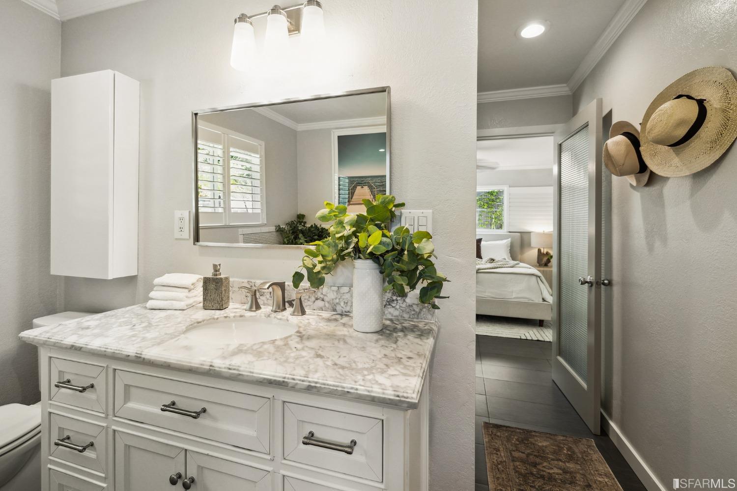 1615 Linda Mar Boulevard Pacifica, CA 94044 - Photo 27 of 41 a bathroom with a granite countertop sink a mirror and a shower