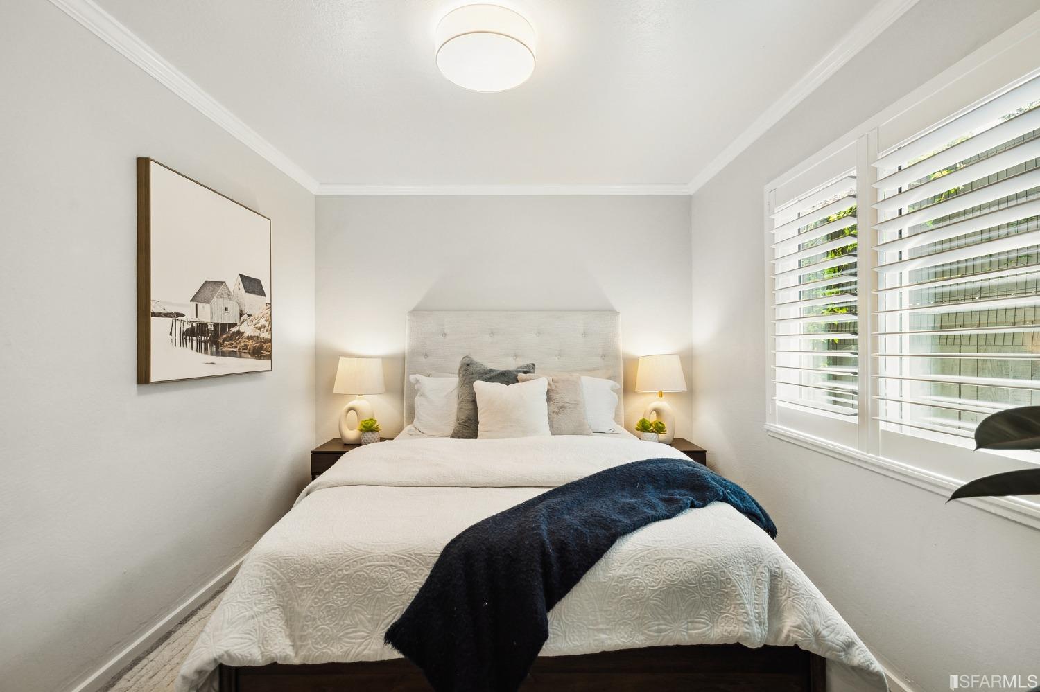 1615 Linda Mar Boulevard Pacifica, CA 94044 - Photo 37 of 41 a bedroom with a bed and a window