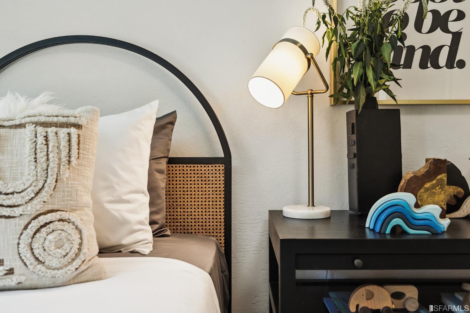 1615 Linda Mar Boulevard Pacifica, CA 94044 - Photo 39 of 41 a bedroom with a bed and a chandelier