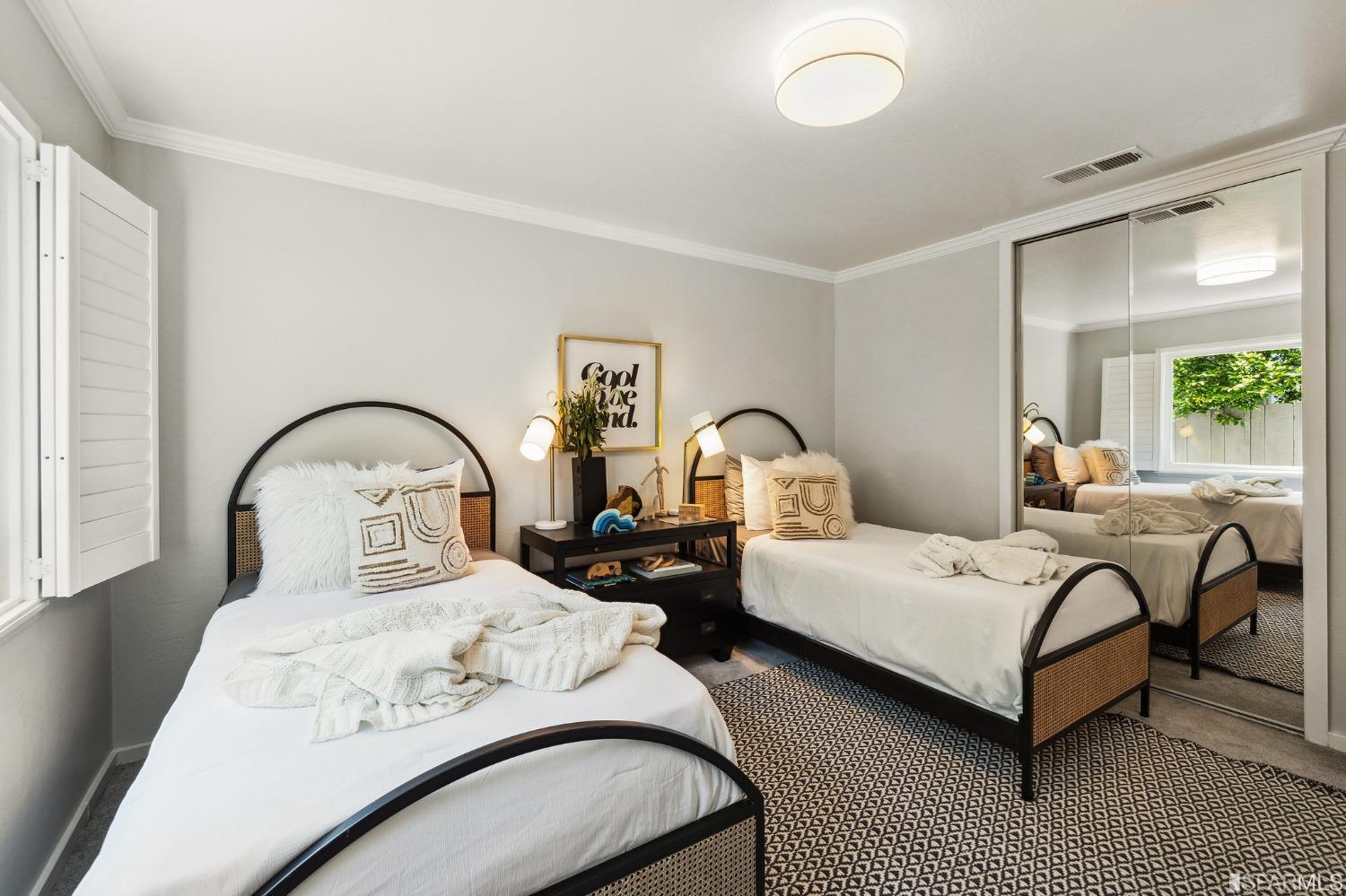 1615 Linda Mar Boulevard Pacifica, CA 94044 - Photo 40 of 41 a bedroom with bed a table and window