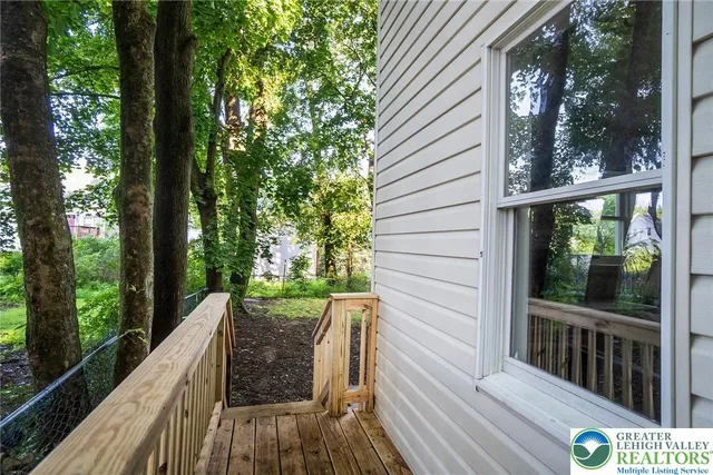 a view of balcony with wooden floor and outdoor space