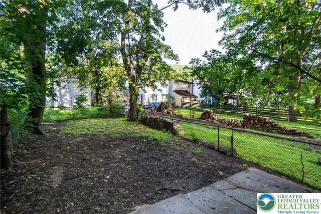 a view of park with large trees