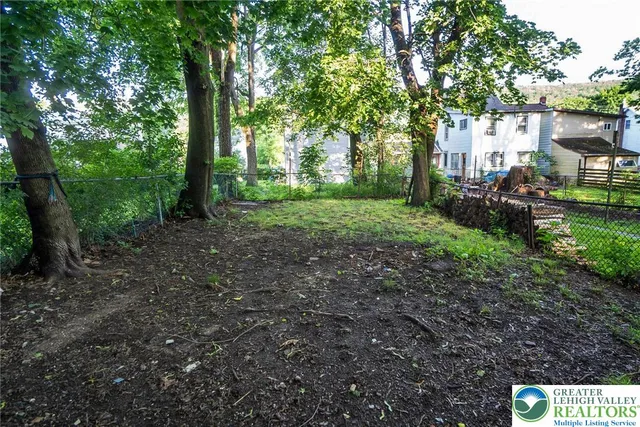 a view of outdoor space with deck and yard