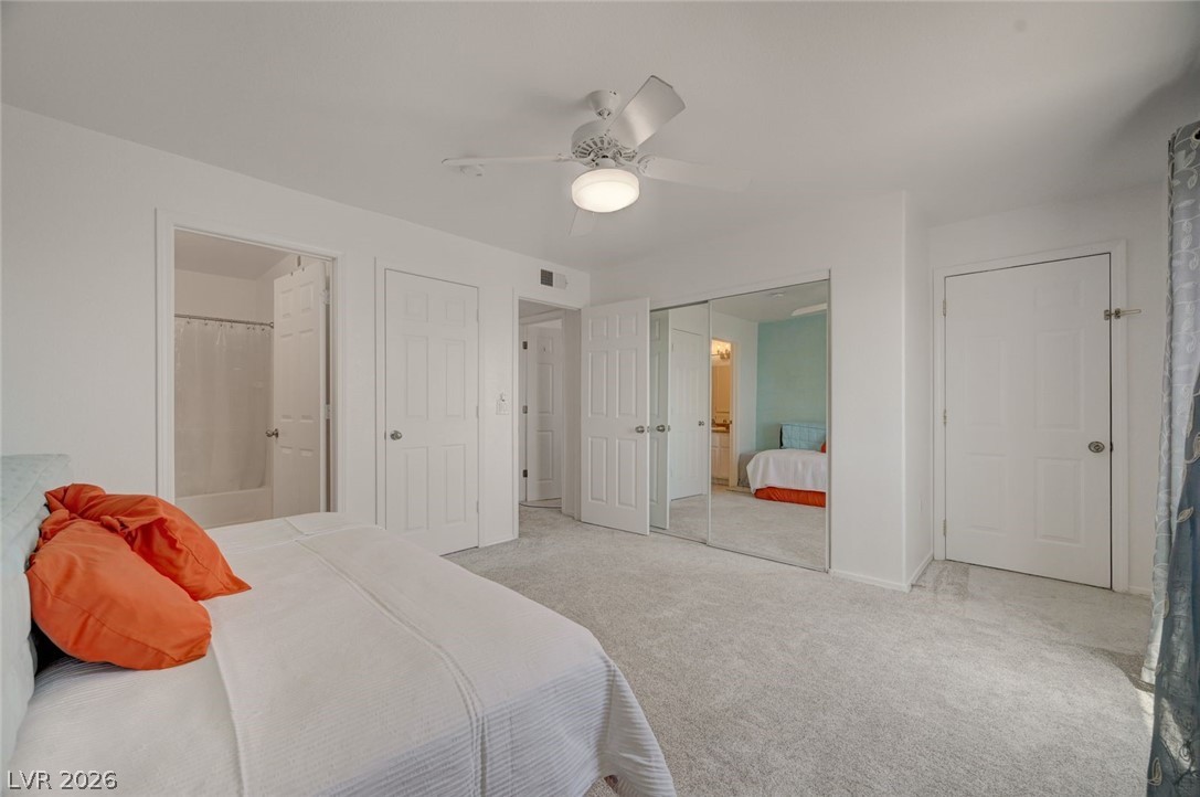 3318 North Decatur Boulevard, Unit 2072 Las Vegas, NV 89130 - Photo 21 of 50 A well-lit room offers ample storage with mirrored closet doors and soft carpeting underfoot.