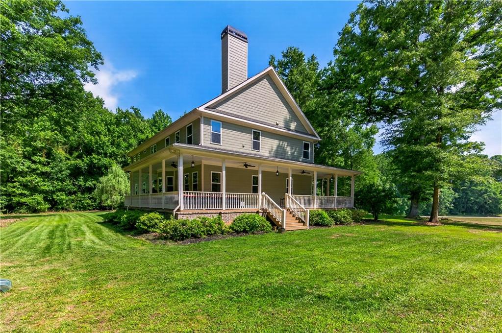 632 Geiger Road Jefferson, GA 30549 - Photo 49 of 55 a front view of a house with a yard table and chairs
