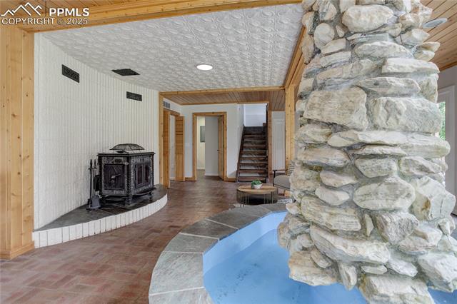 Stunning rock column w/ fountain & koi pond