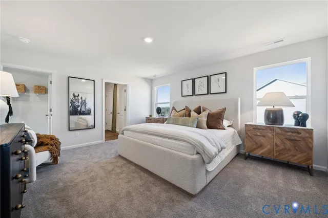 a spacious bedroom with a bed and window