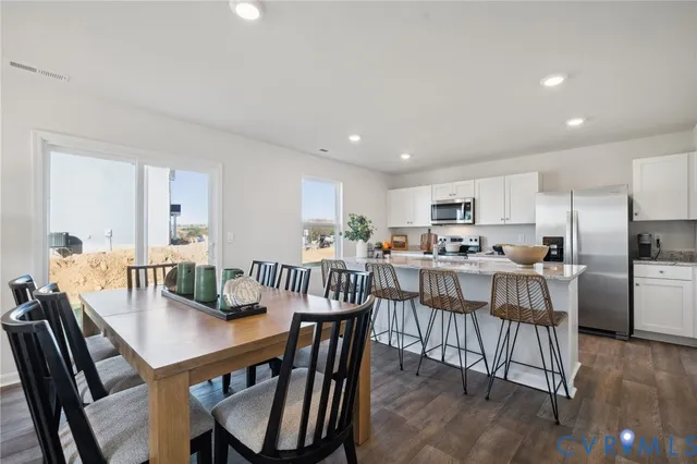 a view of kitchen with dining table and chairs