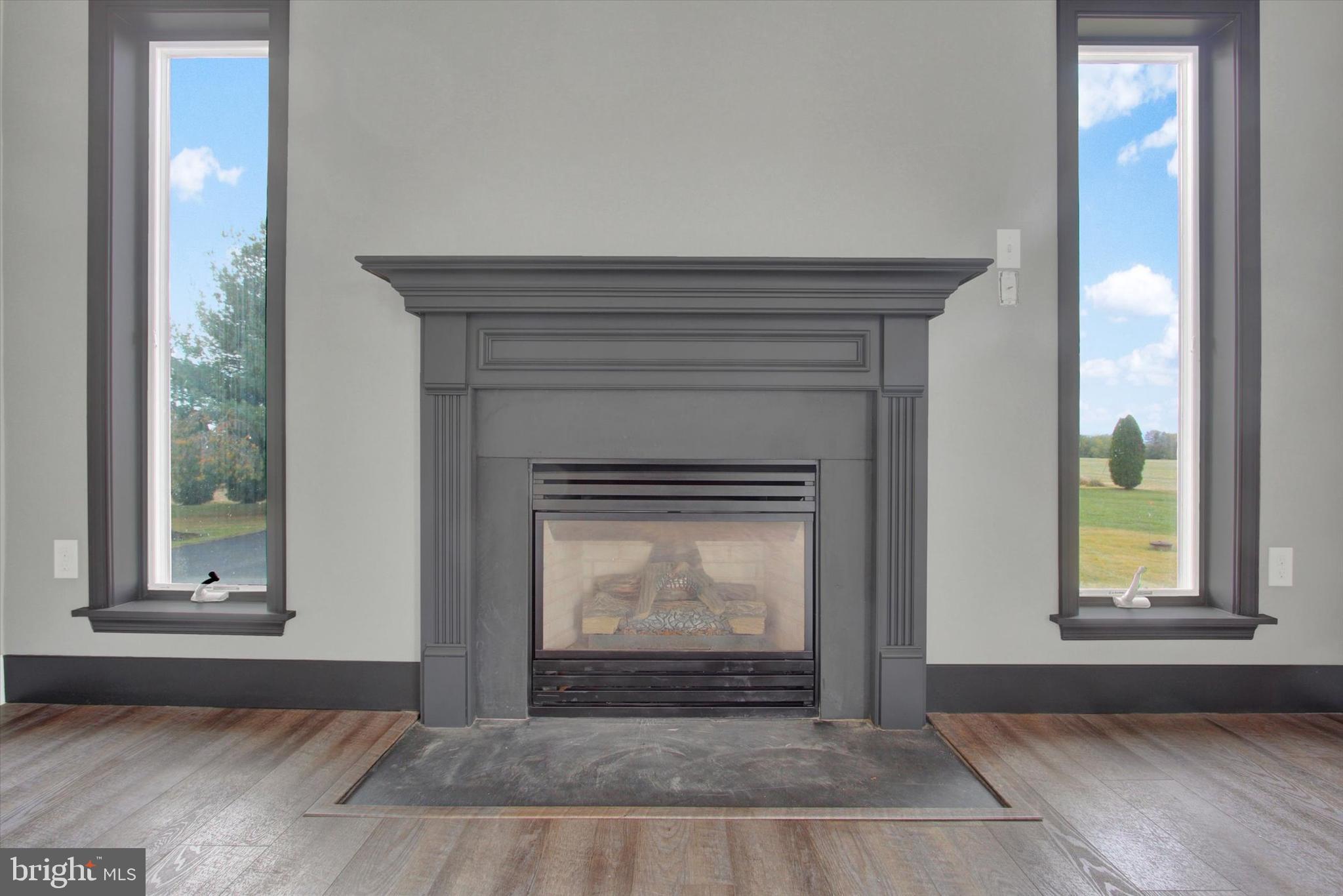 30 Harney Road Littlestown, PA 17340 - Photo 13 of 45 a living room with a fireplace and a window