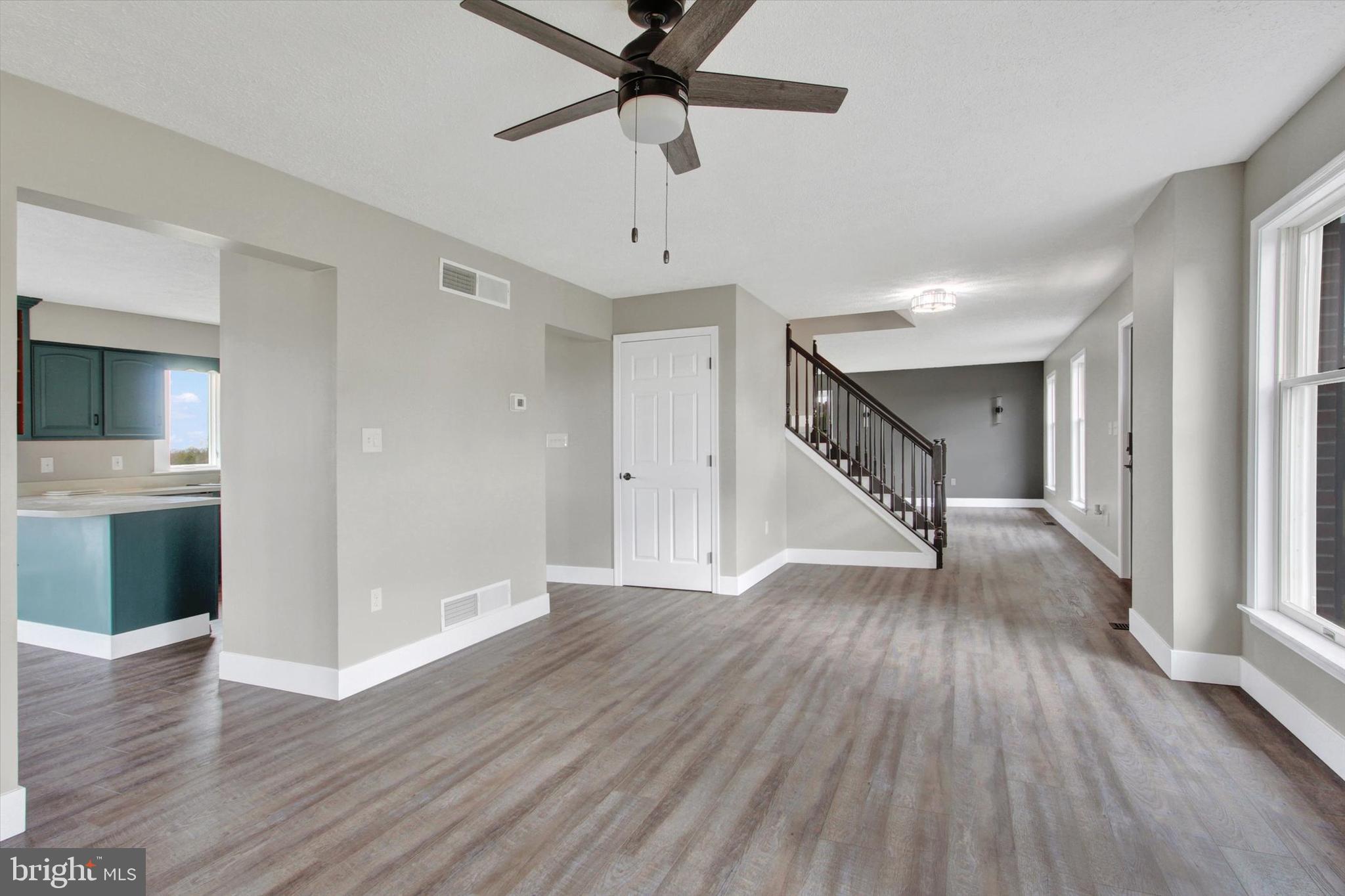30 Harney Road Littlestown, PA 17340 - Photo 16 of 45 a view of empty room with wooden floor and ceiling fan