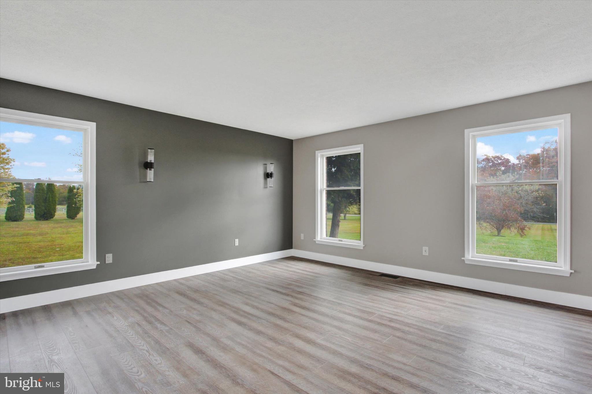 30 Harney Road Littlestown, PA 17340 - Photo 17 of 45 a view of an empty room with wooden floor and a window