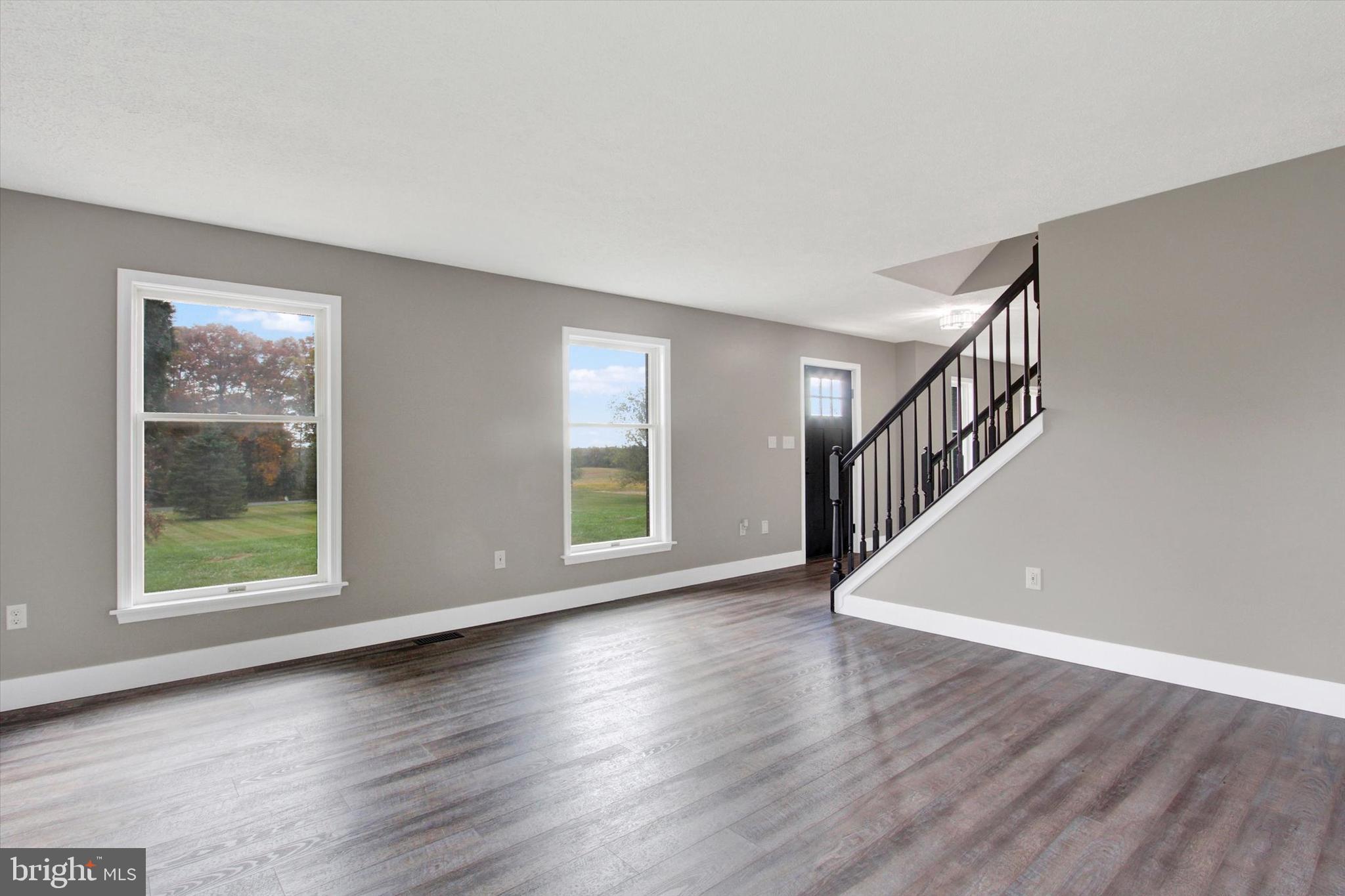 30 Harney Road Littlestown, PA 17340 - Photo 18 of 45 a view of an empty room with wooden floor and a window