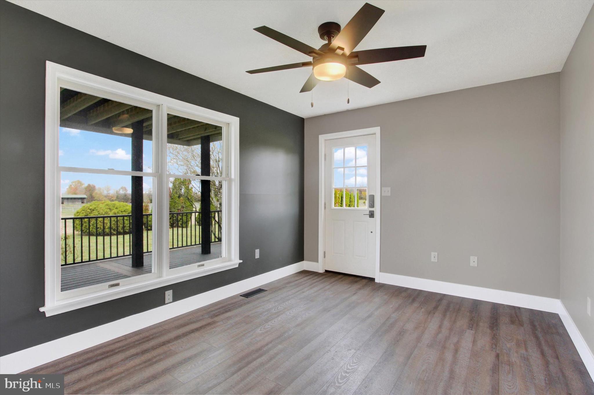 30 Harney Road Littlestown, PA 17340 - Photo 20 of 45 an empty room with wooden floor and a ceiling fan