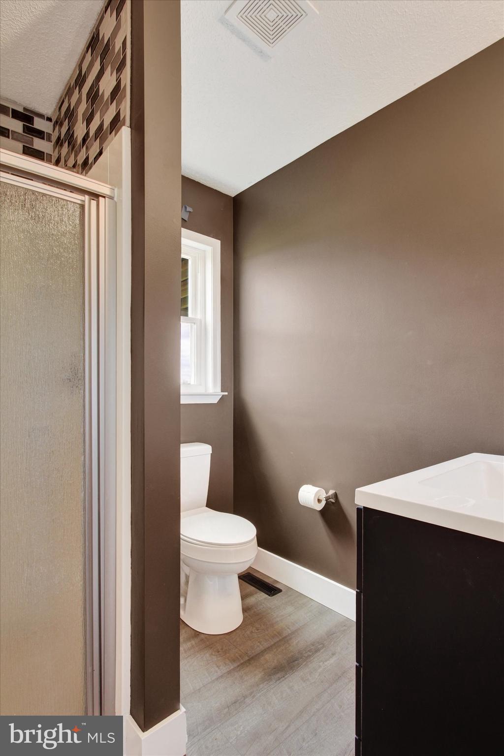 30 Harney Road Littlestown, PA 17340 - Photo 21 of 45 a bathroom with a toilet and a sink
