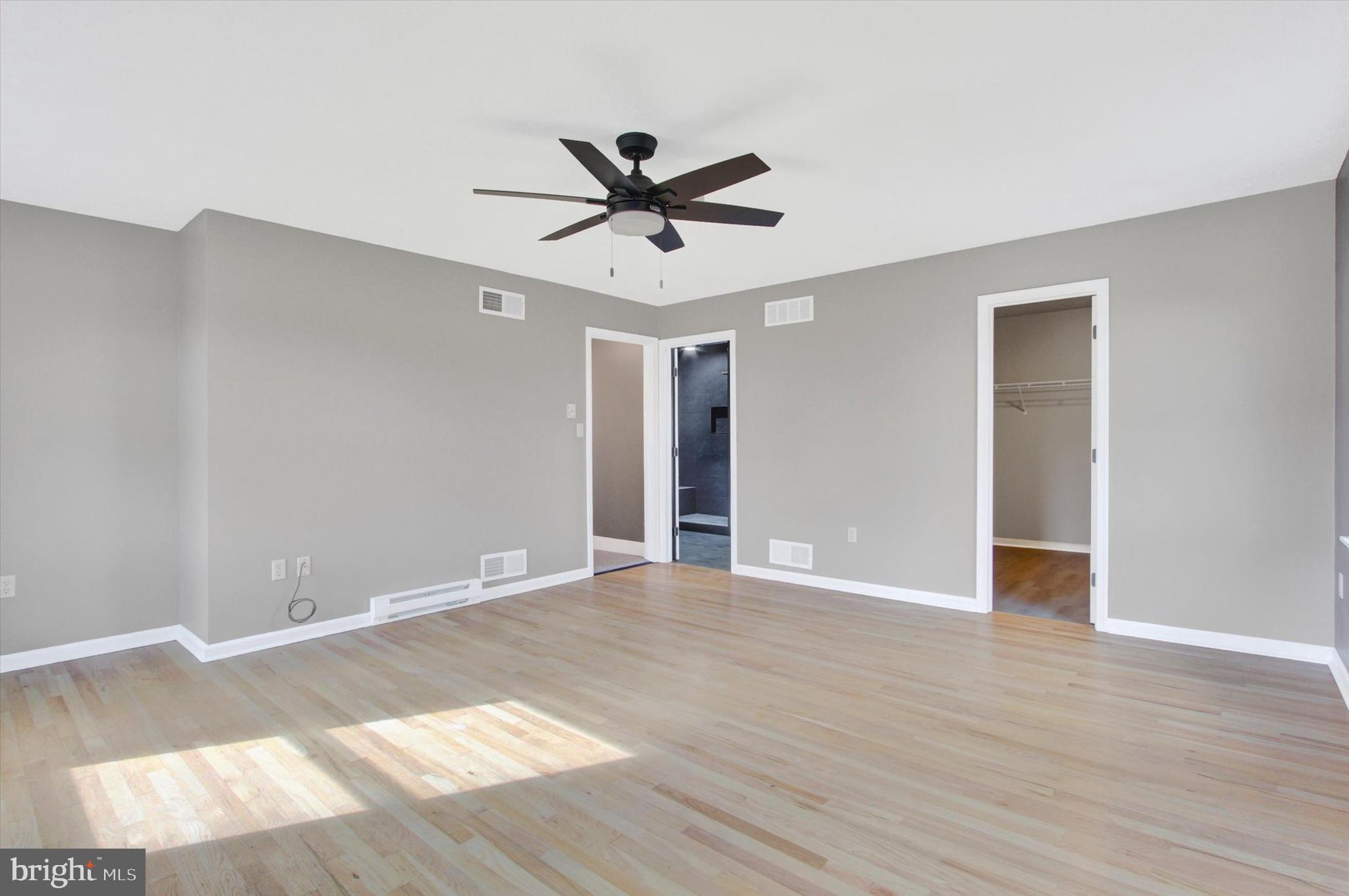 30 Harney Road Littlestown, PA 17340 - Photo 24 of 45 a view of an empty room with wooden floor and a ceiling fan