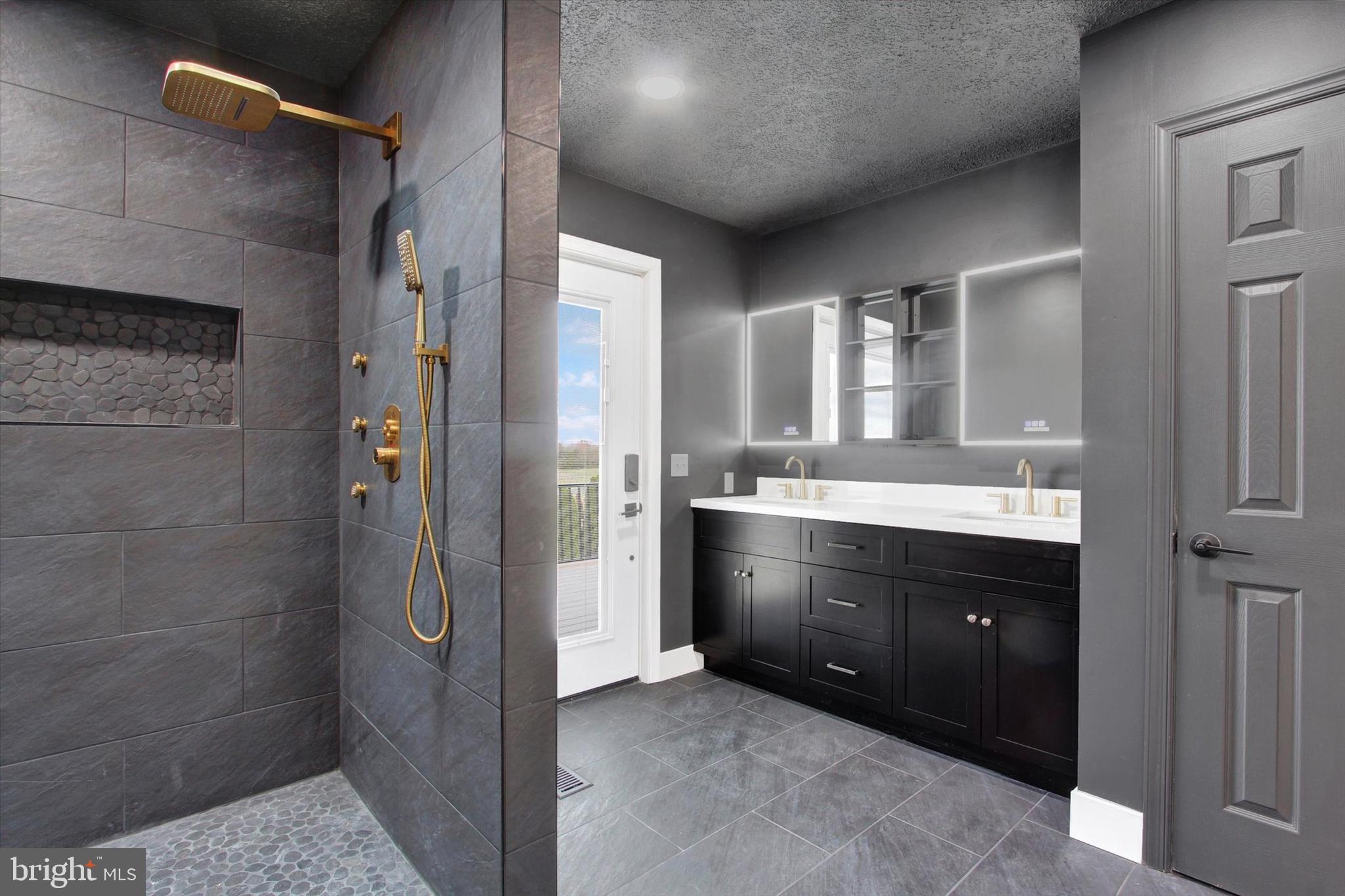 30 Harney Road Littlestown, PA 17340 - Photo 25 of 45 a bathroom with a double vanity sink a mirror and a shower