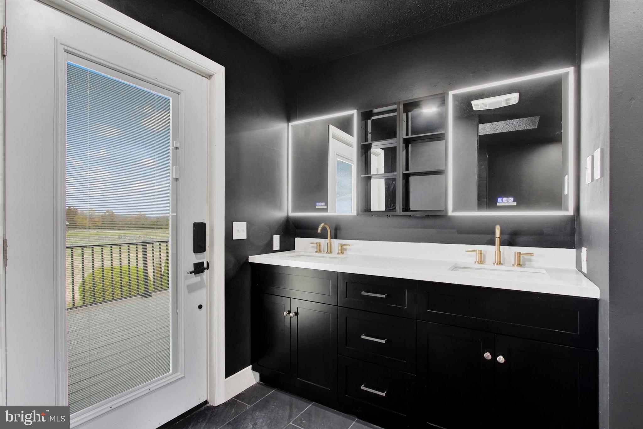30 Harney Road Littlestown, PA 17340 - Photo 27 of 45 a bathroom with a double vanity sink and a mirror