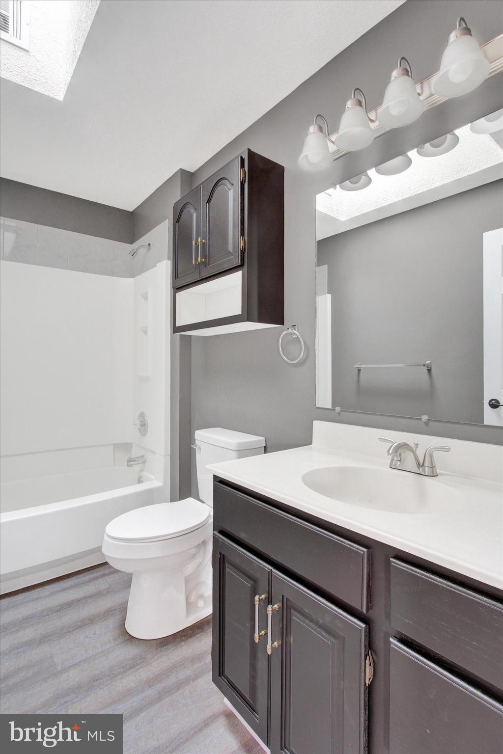 30 Harney Road Littlestown, PA 17340 - Photo 31 of 45 a bathroom with a sink toilet a mirror and bathtub
