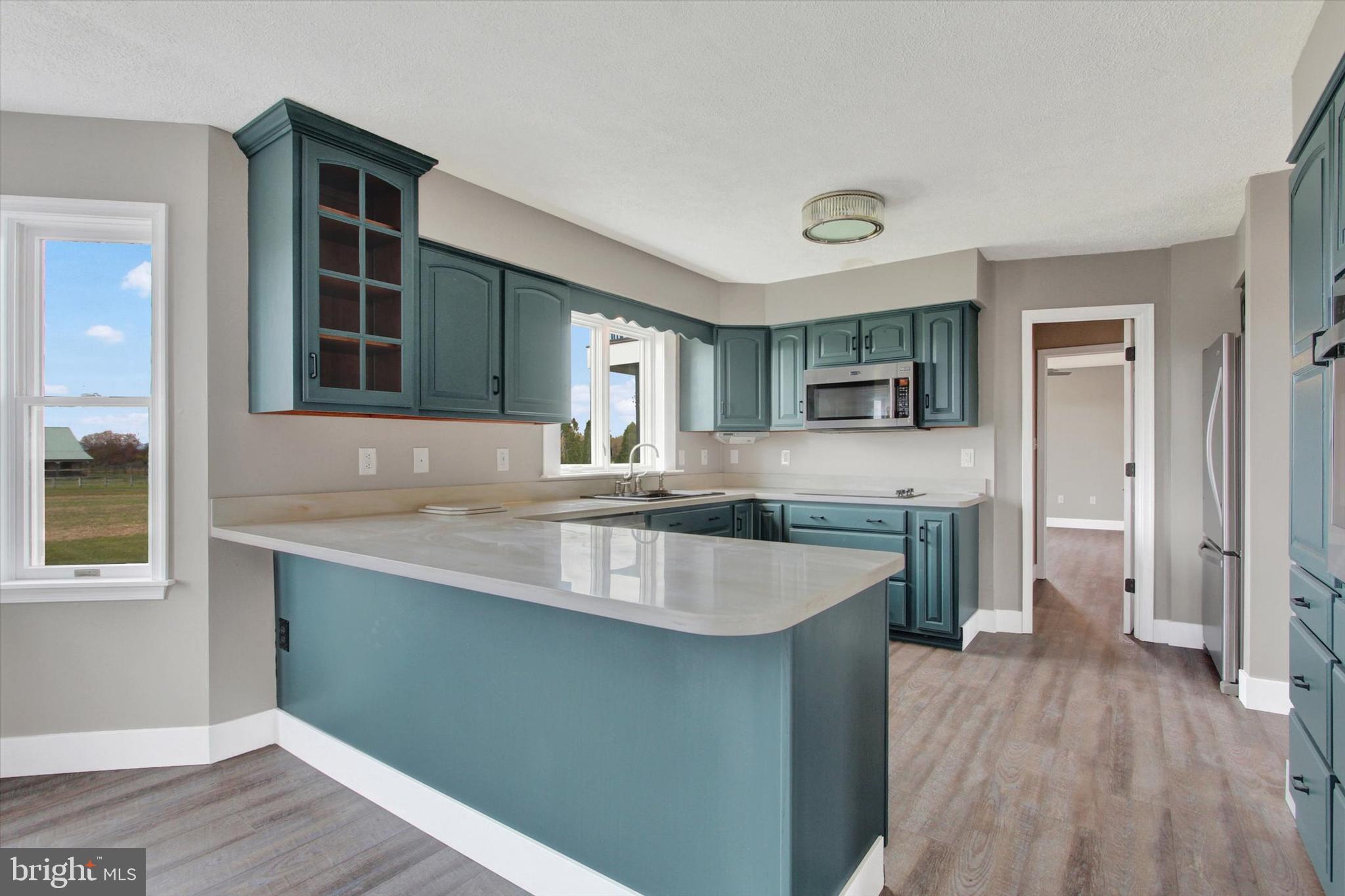 30 Harney Road Littlestown, PA 17340 - Photo 5 of 45 a kitchen with granite countertop a sink and wooden floor