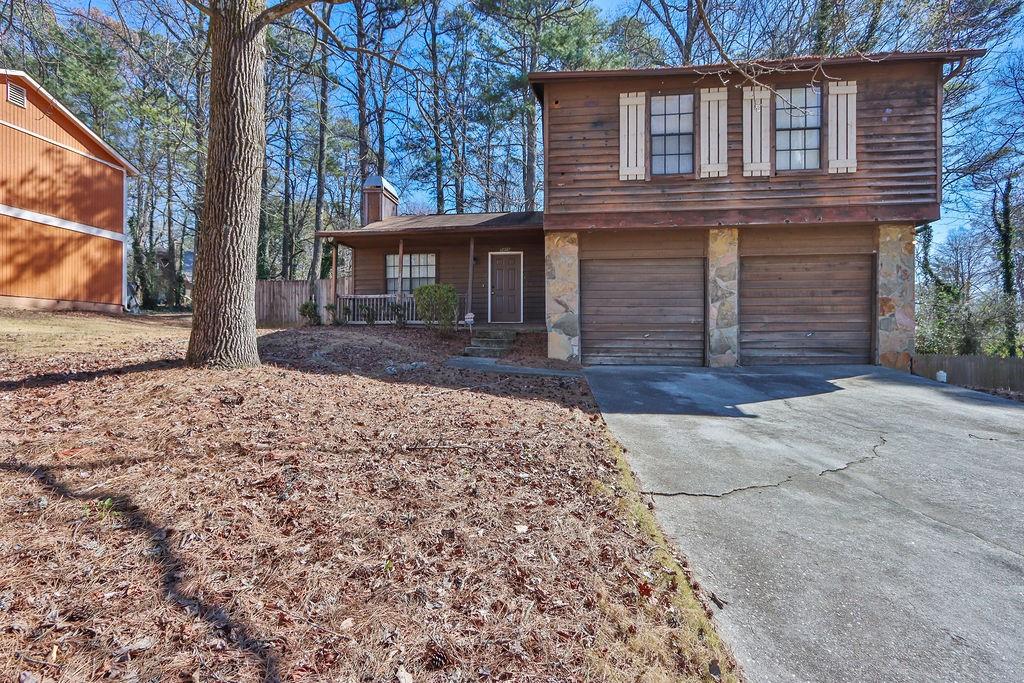 5409 Biffle Downs Road Stone Mountain, GA 30088 - Photo 1 of 27 front view of a house with a yard