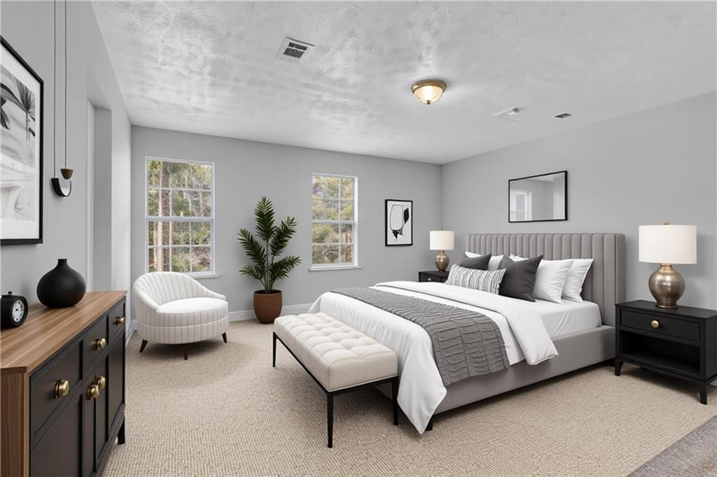 5409 Biffle Downs Road Stone Mountain, GA 30088 - Photo 18 of 27 a bedroom with a bed and a couch