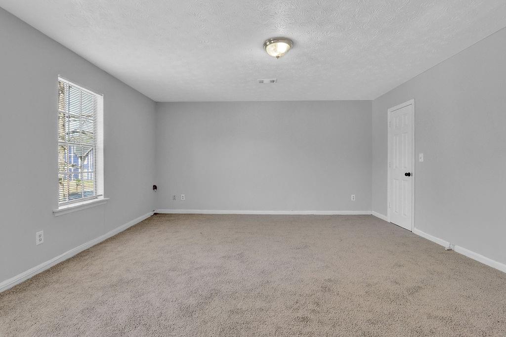 5409 Biffle Downs Road Stone Mountain, GA 30088 - Photo 19 of 27 a view of an empty room with a window