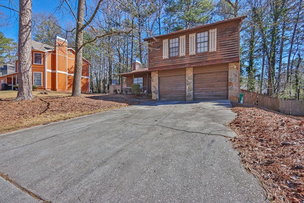 5409 Biffle Downs Road Stone Mountain, GA 30088 - Photo 2 of 27 a view of a yard with a house