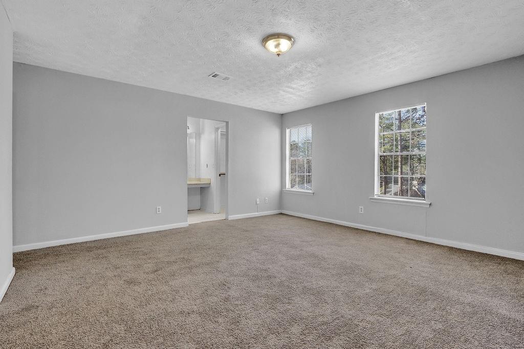 5409 Biffle Downs Road Stone Mountain, GA 30088 - Photo 21 of 27 a view of an empty room with a window
