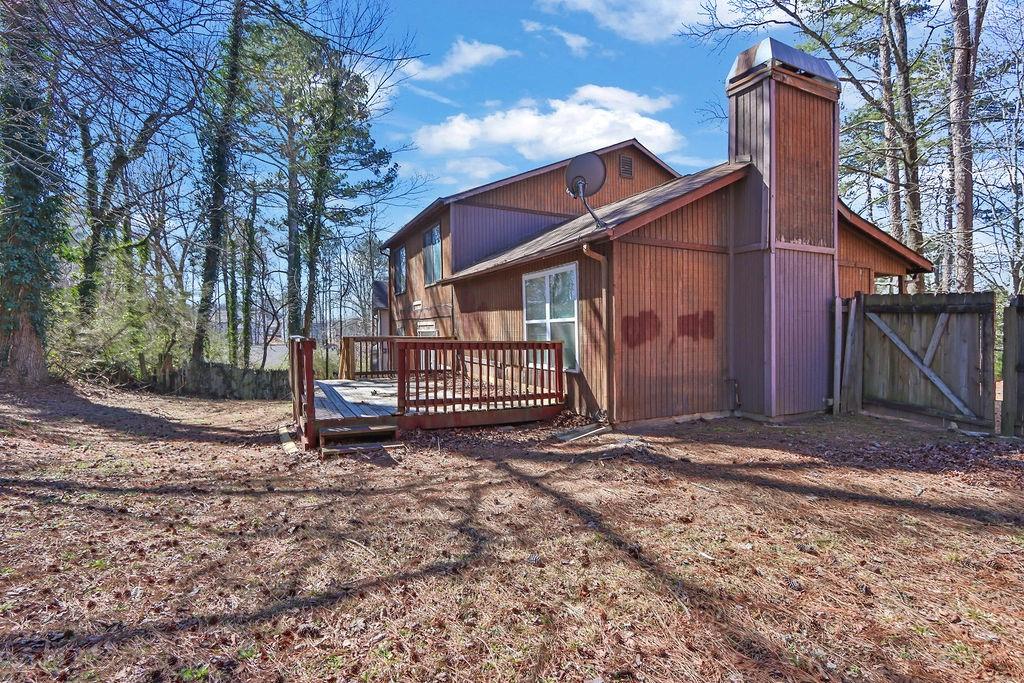 5409 Biffle Downs Road Stone Mountain, GA 30088 - Photo 23 of 27 a view of a house with a yard