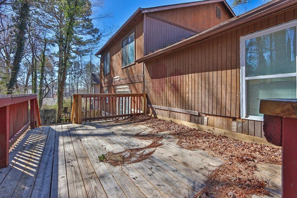 5409 Biffle Downs Road Stone Mountain, GA 30088 - Photo 24 of 27 a backyard of a house with wooden floor